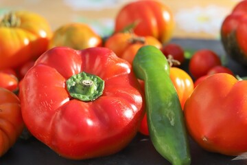 close up of variety of tomatoes and peppers