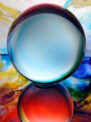 Lens Ball with abstract background and reflection.