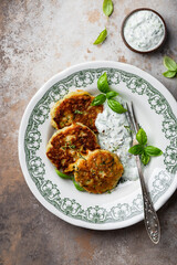 zucchini and parmesan fritter with tzatziki sauce