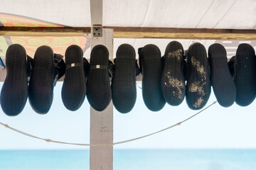 Diving shoes are drying. Underwater swimming equipment. Rubber diving boots