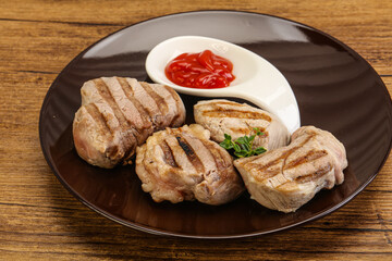 Grilled pork tenderlion with tomato sauce