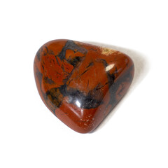 Red and multicolored jasper polished tumblestones narrow focus line, shallow depth of field macrophoto