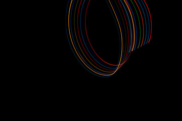 Luminous multicolored wavy lines rainbow on a black background