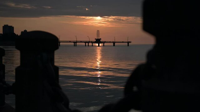 Silhouette of a Pier During Sunrise