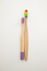 Bamboo toothbrushes on a white background. Colored bristles.