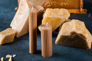 A handmade candle made of natural wax with texture of honeycomb bees. beeswax for craft candles....