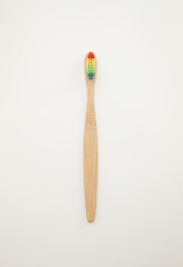 Bamboo toothbrushe on a white background. Colored bristles