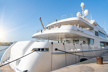 Large catamaran at the marina. Pleasure or passenger catamaran on the pier.