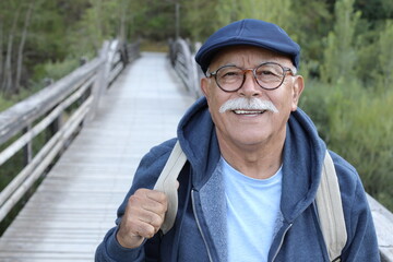 Ethnic senior man walking outdoors