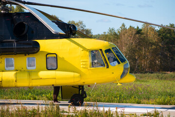 yellow rescue medical helicopter at the site outside the city