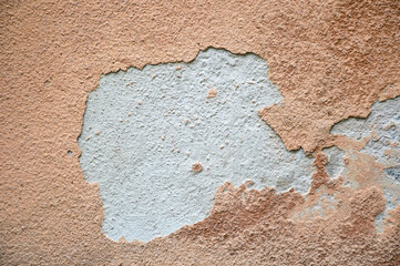 Old concrete wall with peeling plaster