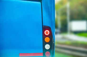 Backlights of a blue colored bus