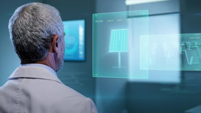 man in laboratory working on renewable green energy sources examining data,clean energy expert using virtual display technology