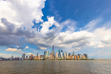 Summer clouds cover the Lower Manhattan skyscraper on June 9 2021 in New York City NY USA. - obrazy, fototapety, plakaty