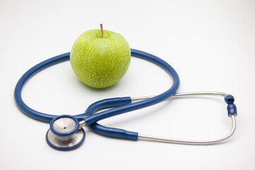 Apple on white background,stethoscope and apple.