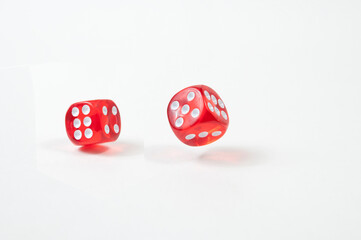 red dice in motion close-up on a white background