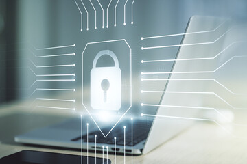 Double exposure of creative lock hologram with chip on laptop background. Information security concept