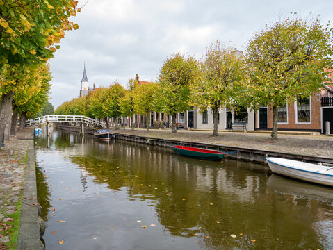 Canal and houses on Heerenwal quay in city of Sloten, Sleat, Friesland, Netherlands