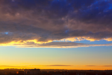 Fototapeta premium Evening clouds over the city . Cloudscape over the horizon in the twilight