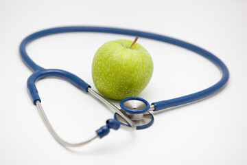 Apple on white background,stethoscope and apple.