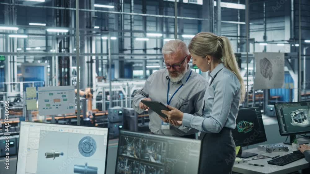 Poster car factory office: manager talks with senior engineer, use tablet computer to design production con