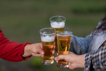 A group of friends cheered the beer and laughed happily on the holidays.