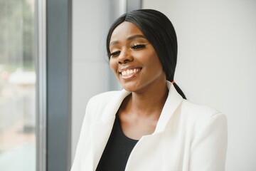 portrait of young pretty african american businesswoman in office
