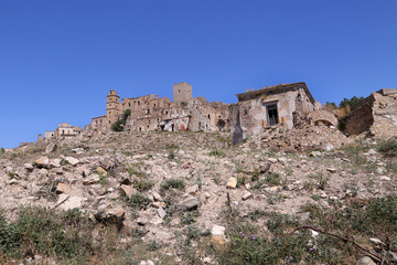 Fototapeta premium Scenic view of Craco ruins, ghost town abandoned after a landslide, Basilicata region, southern Italy
