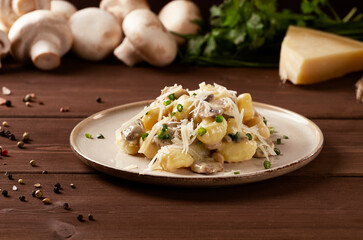 Gnocchi with mushrooms, in cream sauce, Italian dish, horizontal, no people, selective focus,