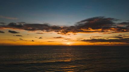 Red purple orange blue pink sunsets over sea and Burning sky and shining.Beautiful Sunrise good weather abstract nature background. 