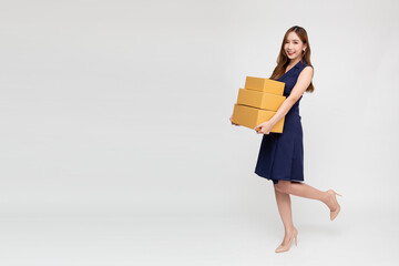 Happy Asian woman smiling and holding package parcel box isolated on white background, Delivery courier and shipping service concept, Full body composition