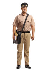 Full length portrait of a mailman with a bag smiling at camera