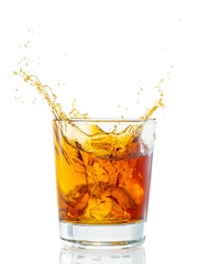splash from falling ice glass with whiskey on white background