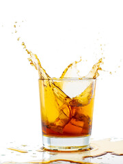 Fototapeta na wymiar splash from falling ice glass with whiskey on white background