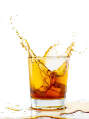 splash from falling ice glass with whiskey on white background