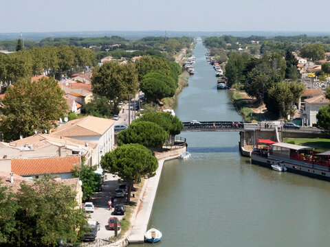 Aigues-Mortes France. The port city of Aigues-Mortes. Yachts moored off the coast. The maritime channel flows into the Mediterranean Sea. The concept of historical and photographic tourism