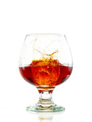 splash and flow in a round brandy glass