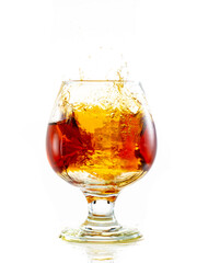 splash and flow in a round brandy glass