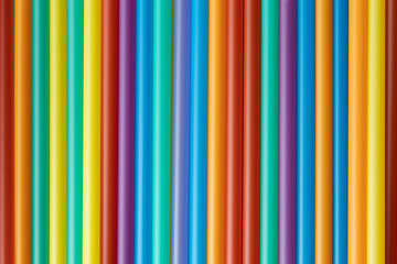 Close up of colorful plastic straws. Background