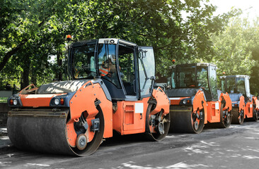 Modern rollers on city street. Road repair service