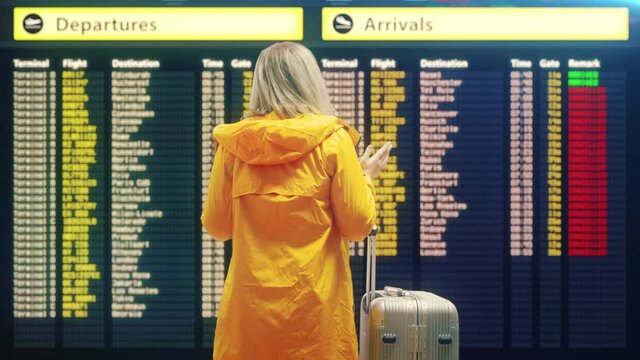 Young woman outraged with flight cancelation, waiting in airport, emergency