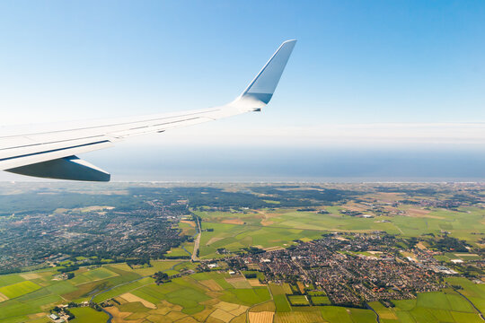 Plain wing over Holland. Flight from Helsinki to Amsterdam.