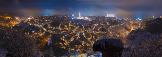 Panoramic aerial night view of the skyline of the old European city on a foggy night,  Filomena,...