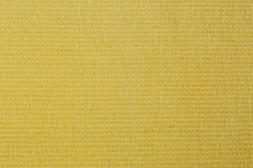 Yellow beach towel as background, top view
