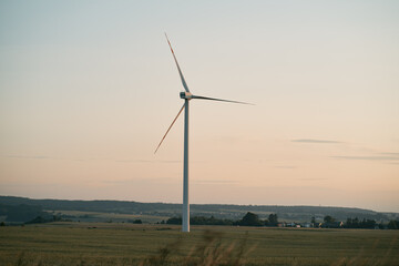 Fototapeta na wymiar Wind turbine farm in the rural area in Poland. Renewable energy in the Europe