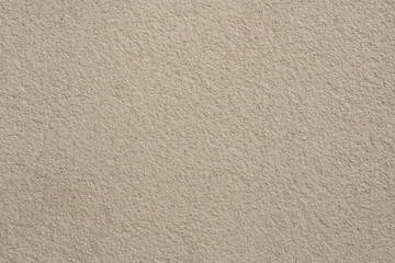 Chef's hands gloved in latex slicing a ripe tomato on a white teflon board