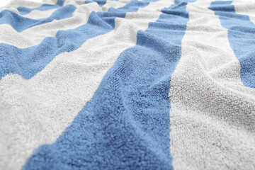 Crumpled striped beach towel as background, closeup view