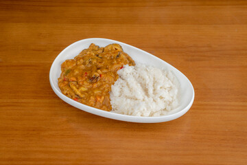 Great serving of vegan curry with white and red vegetable curry rice