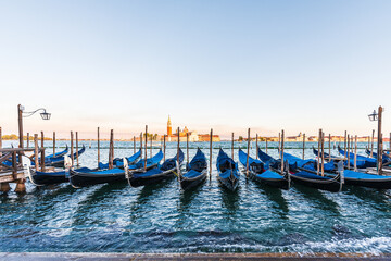 View of the gondolas from Piazza San Marco at sunset, Venice, Italy.  