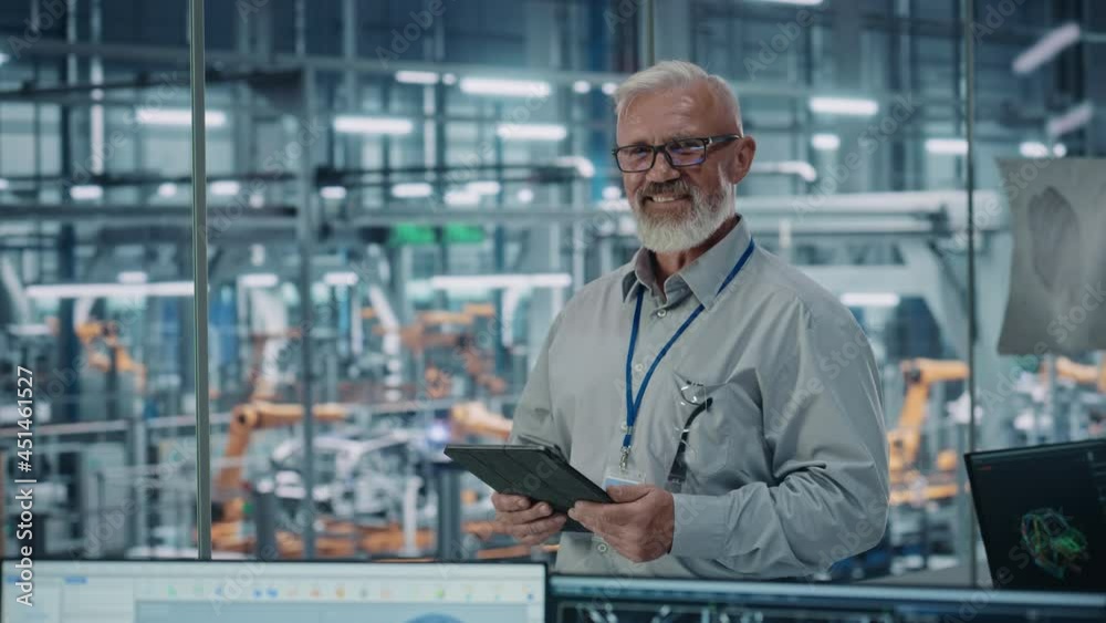 Aufkleber car factory office: portrait of senior white male chief engineer using tablet computer in automated 